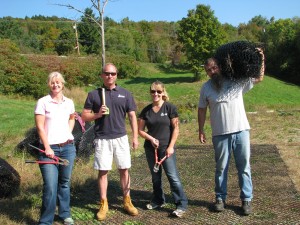 Employees volunteer with post-Irene cleanup at Couples Club in Waitsfield.